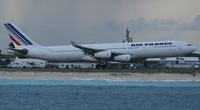 F-GLZR @ TNCM - Air france taking off at TNCM on a rainy day - by Daniel Jef