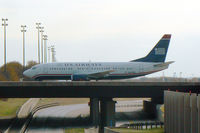N334AW @ DFW - US Air crossing the south bridge at DFW Airport - TX
(taken through the windshield on the service road :) - by Zane Adams