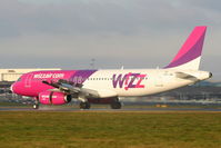 HA-LWB @ EGGW - Wizzair A320 landing on RW26 - by Chris Hall