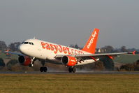 G-EZFS @ EGGW - easyJet A319 landing on RW26 - by Chris Hall
