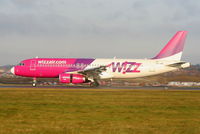 HA-LWB @ EGGW - Wizzair A320 landing on RW26 - by Chris Hall