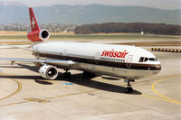 HB-IWB @ GVA - MD-11 of Swissair taxying to the terminal at Geneva in March 1993 - the aircraft was later to be converted to freighter configuration. - by Peter Nicholson