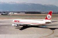 OD-AHE @ GVA - Boeing 707-323C of Lebanon's Middle East Airlines heading for the active runway at Geneva in March 1993. - by Peter Nicholson