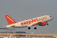 G-EZBY @ EGCC - easyJet A319 departing from RW05L - by Chris Hall