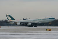 B-HUH @ EGCC - Cathy Pacific B747 landing on RW05L - by Chris Hall