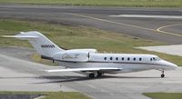 N990QS @ TNCM - N990QS taxing for departure at TNCM