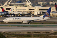 N87512 @ LAX - United Airlines N87512 (FLT COA17) holding short of RWY 25R on Taxiway Papa after arrival on RWY 25L from Newark Liberty Intl (KEWR). New United titles.