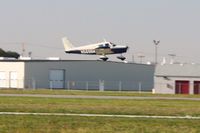N5696W @ TDZ - Arriving at the EAA breakfast fly-in at Toledo, Ohio - by Bob Simmermon
