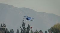 N540BE @ CCB - Approaching the outer fence - by Helicopterfriend