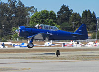 N2832V @ KWVI - North American AT-6G in dark blue colors with USMC titles (no nose art on port side) landing @ 2010 Watsonville Fly-In - by Steve Nation