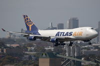 N409MC @ YSSY - City background...arriving 34R - by Bill Mallinson