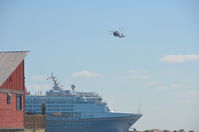 6022 - Coast Guard Helicopter at Castaway Cay in the Bahamas flying around the Disney Magic Cruise Ship.