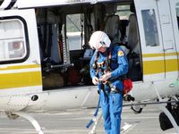 N17LA @ POC - Taking off the rescue harness the crew member uses when doing a hoisting rescue - by Helicopterfriend