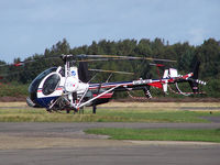 G-ICBI @ EGLK - Schweizer next to R22 and R44s - by Manxman