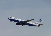 N489UA @ ONT - Gaining altitude after take off fronway 26R, notice wheels coming up - by Helicopterfriend