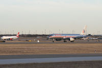 N619AA @ DFW - American Airlines 757 arrives on runway 36L while Virgin America departs on 36R.