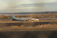 N236AL @ KBIL - Alpine Air Beech 99 taxi's to 28R Jan 21,2011 - by Daniel Ihde