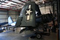 N83782 @ KCNO - Corsair inside the Navy hangar. This is just 1 of the birds used in the TV series Black Sheep Squadron. - by Nick Taylor Photography