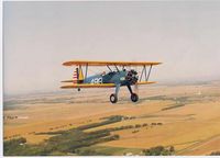 N4988G - Stearman PT-17 N4988G.  Flying near Galesburg, IL during the National Stearman Fly-in, 1989.  Owned & flown by Rick Rice. - by Joe Fleeman
