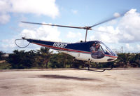 N9087 @ SPN - Macaw Helicopter Sightseeing Flights , Jul '92 - by Henk Geerlings