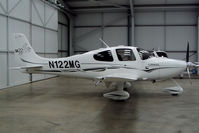 N122MG @ EGBT - Parked in Cirrus hangar