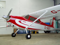 G-ASIT @ EGBT - In the back of the Cirrus hangar