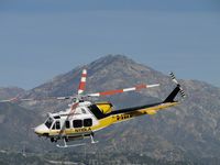 N110LA @ POC - After taxiing across taxiway Sierra, ship make a hard right turn and heads westbound for their work - by Helicopterfriend