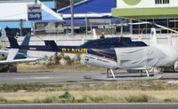 PJ-NHB @ TNCM - PJ-NHB parked on the heli pad at TNCM - by Daniel Jef