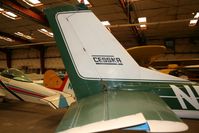 N50415 @ KSSF - Empennage of C150 that was for sale at the museum. Believe it or not, this is one of the youngest aircraft in there. - by Darryl Roach