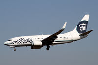 N611AS @ SEA - Landing on 34L - by Duncan Kirk