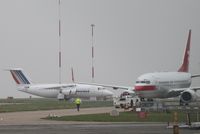EI-RJH @ EGSH - With HB-IIQ being towed past on its way for a re-spray. - by Graham Reeve