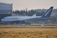 OY-SRG @ EINN - Outside Air Atlantic hanger waiting for a maintenance check