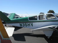 N35HV @ SZP - 1957 Beech H35 BONANZA, Continental O-470-G 240 Hp, H model strengthened V-tail spar caps and elevators. Paint scheme enlarges the appearance of triangular third window. - by Doug Robertson