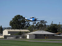 N8667H @ SZP - 1947 North American NAVION, Continental IO-520 285 Hp, on final Rwy 04 with Young Eagles riders. This aircraft & pilot have given well over 600 Young Eagles free aircraft rides. - by Doug Robertson