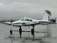 N6714T @ POC - parked in transient parking in the rain - by Helicopterfriend