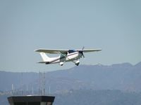 N2471E @ POC - Taking off on runway 8R passing the tower - by Helicopterfriend
