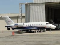 N342FX @ ONT - Parked on the southside and people around - by Helicopterfriend