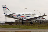 G-CFBX @ EGGW - Beechcraft King Air C90GTI, c/n: LJ-1890 at Luton - by Terry Fletcher