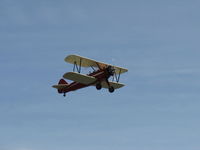 N66711 @ SZP - 1941 Boeing Stearman IB75A, Jacobs R-755B2 275 Hp upgrade, restored & recovered, Restricted Experimental class, takeoff climb Rwy 22, Sammy waving - by Doug Robertson