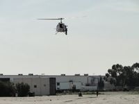 N307SB @ L67 - Deputy on skid working with 2 personnel on the ground - by Helicopterfriend