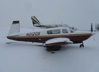 N2120X @ KAXN - Mooney M20R on the line as the snow falls. - by Kreg Anderson