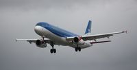 G-MEDH @ EGLL - Not a nice day for pictures, Yet the blue stands out well against the grey background. - by Roger Bushnell
