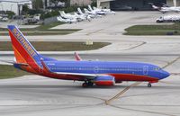 N710SW @ KFLL - Boeing 737-700 - by Mark Pasqualino