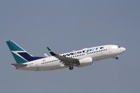 C-FWBL @ KFLL - Boeing 737-700 - by Mark Pasqualino