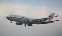 9M-MPM @ EGLL - Landing at Heathrow - by Roger Bushnell