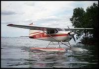 N6577E - Taxiing in on the Oshkosh lake - 1987. - by Ralph Lunt