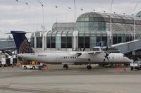 N190WQ @ KORD - DHC-8-400 - by Mark Pasqualino