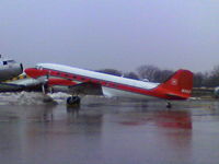 N115Z @ KOSH - Taken on a heavy rain day at Basler Turbo Conversions