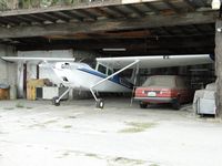 N3322D @ RIR - Parked in the hanger next to the car - by Helicopterfriend
