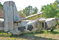 149860 - On the West Side of US-1 about 1 mile south of St.Augustine Airport FL - there is a grassed compound holding 9 x Ex Navy , Grumman Trackers